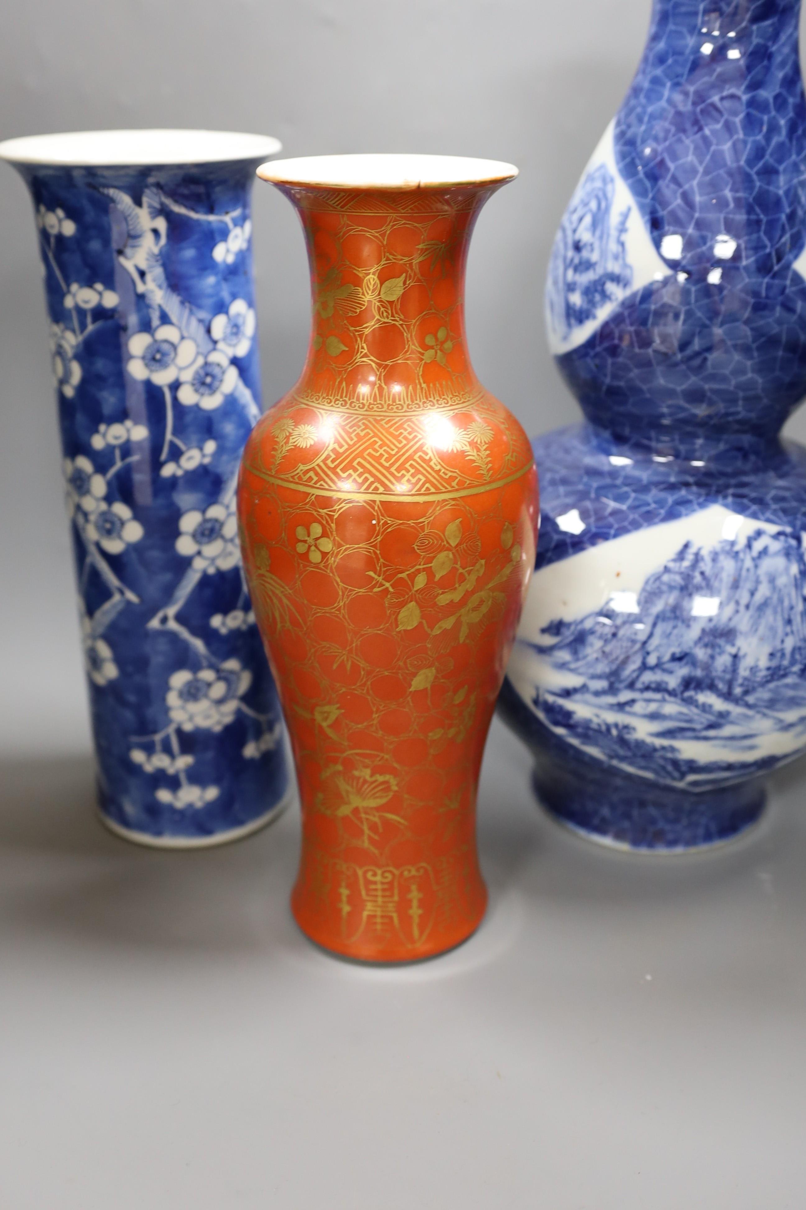 A Chinese blue and white gourd vase with landscape decoration, a similar blue and white sleeve vase and a Japanese Kutani vase